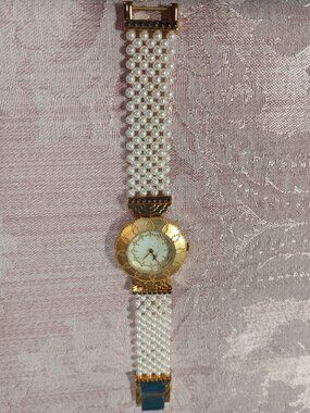 Sevenarts Ltd Erte' Women's gold faced watch with Pearl band VERY RARE